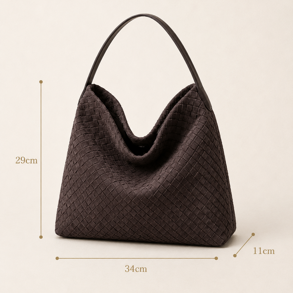 A dark brown woven leather hobo handbag with a single shoulder strap, shown on a light beige background with dimension lines indicating measurements of 29cm height, 34cm width, and 11cm depth.