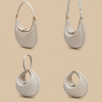 Set of four beige handbags with gold accents on a white background